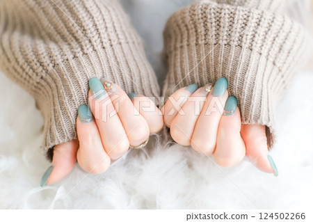 Woman's hands with gel nails and nail art at a nail salon 124502266