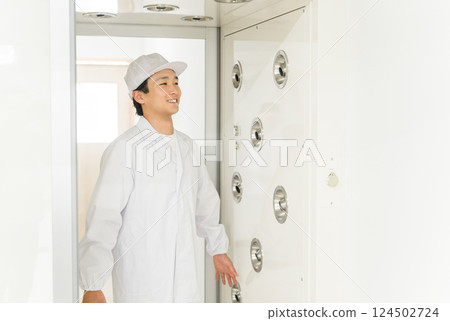 People who work in factories with air showers and clean rooms People who work in factories with air showers and clean rooms 124502724