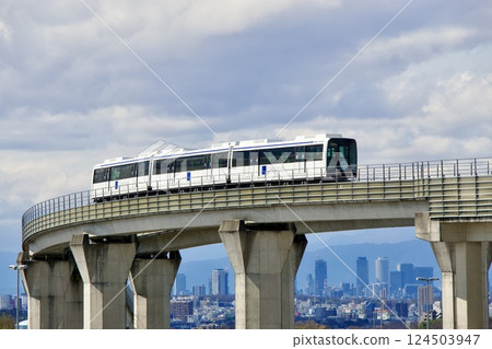 Linimo train running with Nagoya city in the background Linimo train running with Nagoya city in the background 124503947