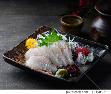 Sea bream sashimi: A dignified Japanese taste, with white fish sashimi and chopsticks 124503968