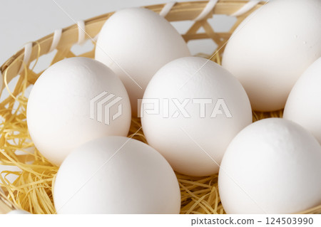 Raw eggs in a basket 124503990