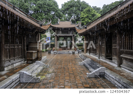 Vietnam, Hanoi, Bell of the Temple of Literature of Hanoi in the rain. 124504367