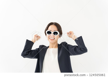 Woman in sunglasses, business, fist pump 124505061