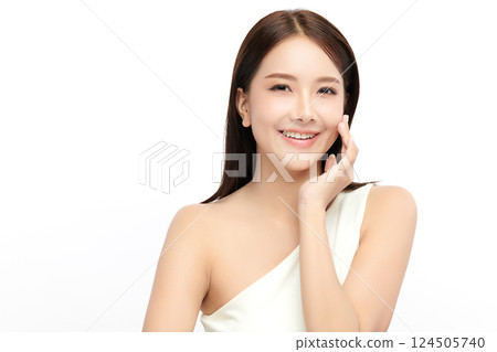 A beautiful young Asian woman with clean, fresh skin against a white background. Skincare, facial treatment, cosmetology, beauty, and spa. An elegant portrait of an Asian woman. A beautiful young Asian woman with clean, fresh skin against a white background. Skincare, facial treatment, cosmetology, beauty, and spa. An elegant portrait of an Asian woman. 124505740