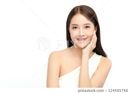 A beautiful young Asian woman with clean, fresh skin against a white background. Skincare, facial treatment, cosmetology, beauty, and spa. An elegant portrait of an Asian woman. A beautiful young Asian woman with clean, fresh skin against a white background. Skincare, facial treatment, cosmetology, beauty, and spa. An elegant portrait of an Asian woman. 124505748