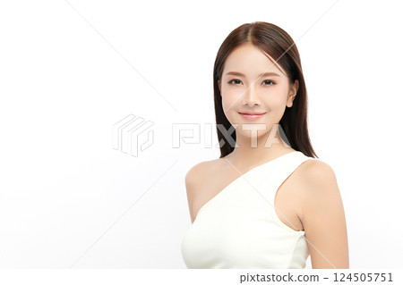 A beautiful young Asian woman with clean, fresh skin against a white background. Skincare, facial treatment, cosmetology, beauty, and spa. An elegant portrait of an Asian woman. 124505751