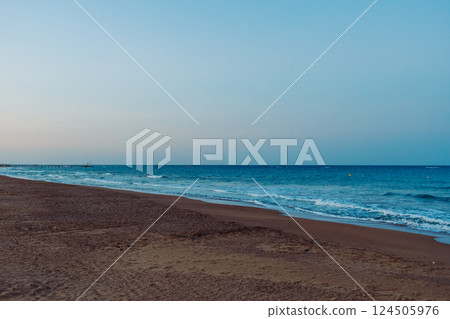 Seascape early in the morning. Mediterranean, azure sea. Dawn on the beach. Turkey Seascape early in the morning. Mediterranean, azure sea. Dawn on the beach. Turkey 124505976
