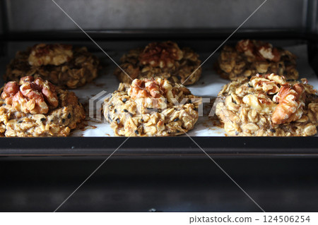 Homemade oat and banana cookies in the oven, dessert for vegan Homemade oat and banana cookies in the oven, dessert for vegan 124506254