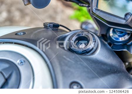 Close-up of the key cylinder of a large motorcycle Close-up of the key cylinder of a large motorcycle 124506426