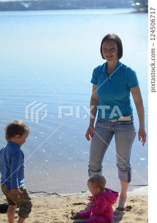 Family Moment by the Lake: Sharing and Bonding Family Moment by the Lake: Sharing and Bonding 124506717