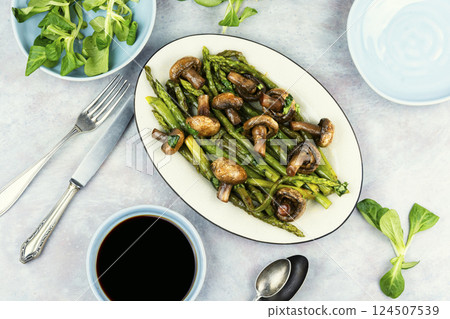 Roasted asparagus and mushrooms. Roasted asparagus and mushrooms. 124507539