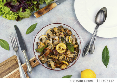 Delicious cooked mushrooms on table. 124507542