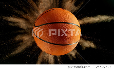 Basketball ball with coloured powder explosion. 124507592