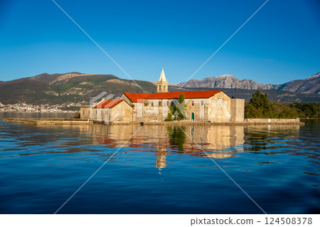 View of Our Lady of Mercy Island from yacht boat near Tivat city in Kotor bay of Adriatic sea in Montenegro in winter time View of Our Lady of Mercy Island from yacht boat near Tivat city in Kotor bay of Adriatic sea in Montenegro in winter time 124508378