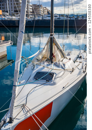 Sailing boats docked in a private marina in the Kotor Bay, Montenegro, showcasing nautical lifestyle, maritime training, and coastal serenity. 124508380