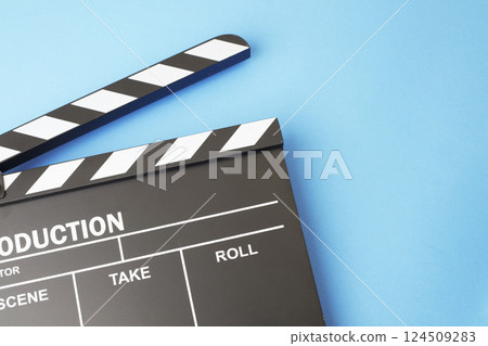 Clapboard on blue background Clapboard on blue background 124509283