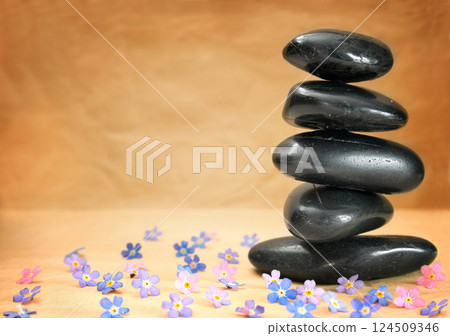 stone tower on brown background stone tower on brown background 124509346