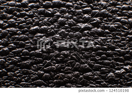 Seamless surface with black sponge foam as background, fine texture similar to leather material Seamless surface with black sponge foam as background, fine texture similar to leather material 124510198