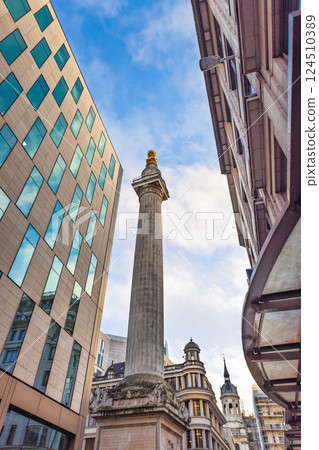 The Monument to the Great Fire of London Surrounded by Modern Architecture 124510389