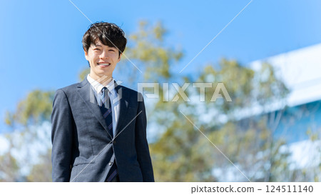 Businessman blue sky 124511140