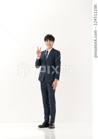 Business man peace sign whole body 124511286