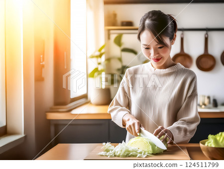 Image of a housewife slicing cabbage Image of a housewife slicing cabbage 124511799