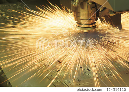 The fiber laser cutting machine  cut the metal plate with the sparkling light. 124514110