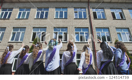 Saying farewell to their school, graduates marking the end of an era and the start of a new journey Saying farewell to their school, graduates marking the end of an era and the start of a new journey 124514739