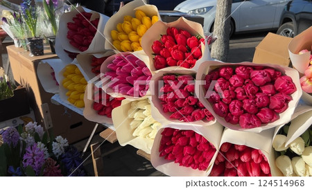 Selling bouquets of tulips on the city street. Selling bouquets of tulips on the city street. 124514968