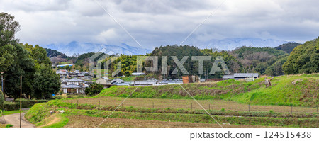 Panorama from Asuka Station to the ruins of Asuka Palace Snow-capped Mount Kongo and Mount Katsuragi in Yamato near the tomb of Emperor Kinmei March 19, 2025 124515438
