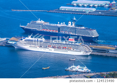 Yokohama cityscape in Japan. View of the departing Noordam. In the foreground is the Asuka II (Seaborne Quest's first arrival) on the 30th. 124515490