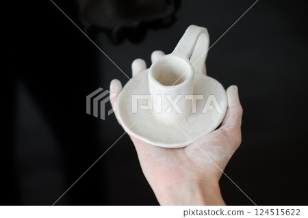 Making pottery from clay, handicraft, clay modeling, master's hands Making pottery from clay, handicraft, clay modeling, master's hands 124515622