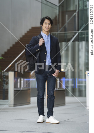 A businessman in his 30s smiling at the camera A businessman in his 30s smiling at the camera 124515735