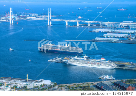 Yokohama cityscape in Japan. View of the departing Noordam. In the foreground is the Asuka II (Seaborne Quest's first arrival) on the 30th. 124515977