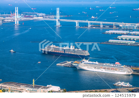 Yokohama cityscape in Japan. View of the departing Noordam. In the foreground is the Asuka II (Seaborne Quest's first arrival) on the 30th. 124515979