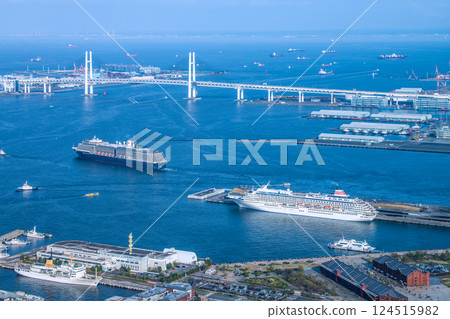 Yokohama cityscape in Japan. View of the departing Noordam. In the foreground is the Asuka II (Seaborne Quest's first arrival) on the 30th. 124515982