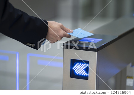 Hands of a businessman passing through a security gate in an office building Hands of a businessman passing through a security gate in an office building 124516904