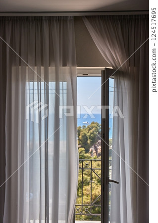 Apartment with sea view, open balcony door 124517695
