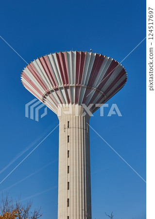 Tall concrete water tower 124517697