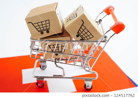 Online shopping, Shopping cart box on Switzerland flag, import export, finance commerce. Online shopping, Shopping cart box on Switzerland flag, import export, finance commerce. 124517762