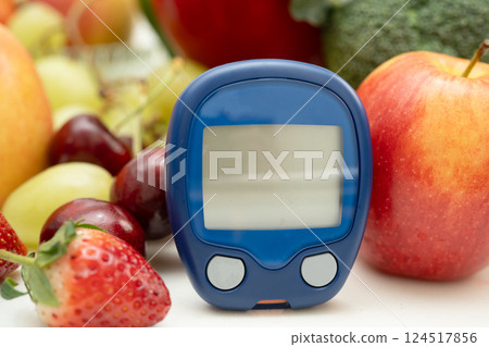 Glucose meter with vegetable and fruit for check sample blood sugar level to treatment diabetes. 124517856