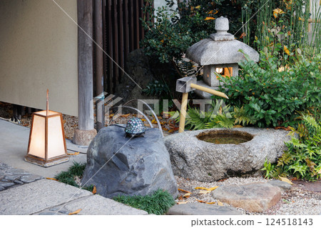 Japan Home Front Yard Garden Fountain Stone Bowl and Lanterns decoration in front of house. Japan Home Front Yard Garden Fountain Stone Bowl and Lanterns decoration in front of house. 124518143