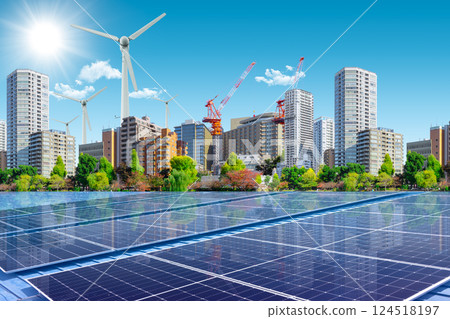 Clean Energy for Green City Concept. Wind Turbine and Solar Panel on Modern Metro Business Building 124518197