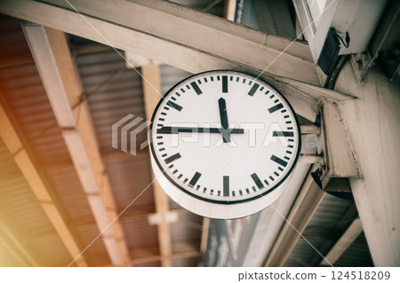 Time clock at train station platform, business people go working at rush hours in city urban metro 124518209