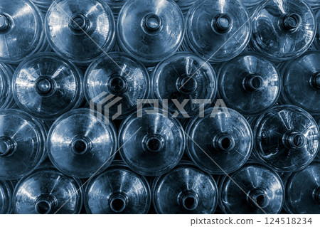 20 liters water gallon PET bottles stacked pile in drink water factory stock warehouse storage area 124518234