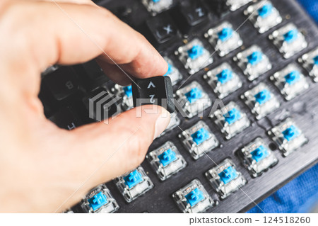 Closeup computer PC keyboard mechanical key under keycaps button for cleaning or change type of key 124518260