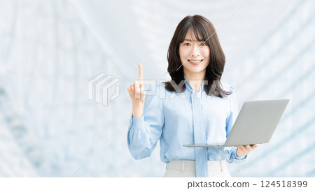 A smiling woman holding a computer and giving directions 124518399