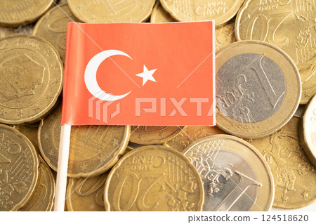 Turkey flag on coin and banknote money, finance trading investment business currency concept. Turkey flag on coin and banknote money, finance trading investment business currency concept. 124518620