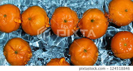 Long fruit banner, tangerines in water, splash of water, top view Long fruit banner, tangerines in water, splash of water, top view 124518846