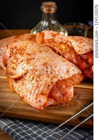 Raw chicken thighs. 124518976